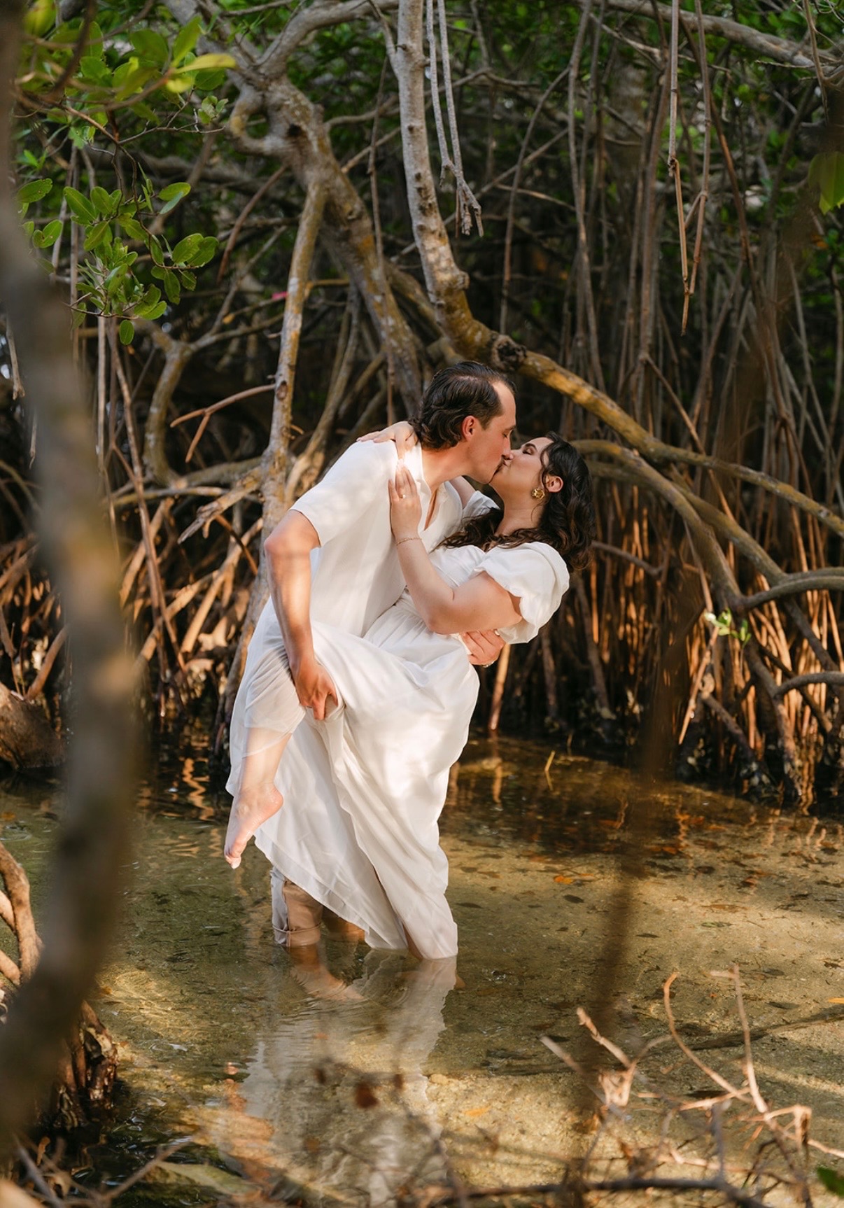Marcus dipping Claudia for a kiss in the water.